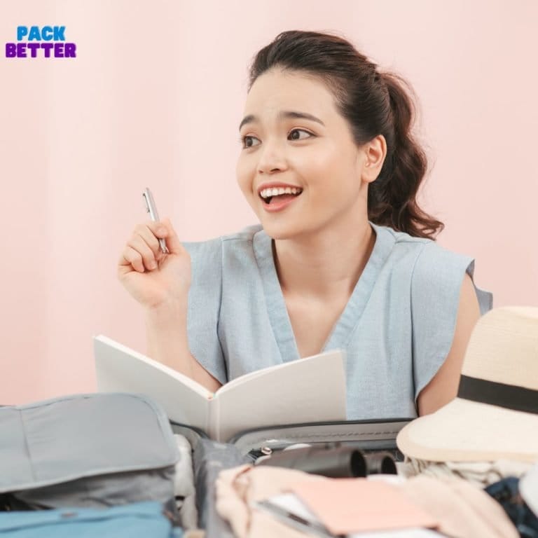 woman packing with a notebook