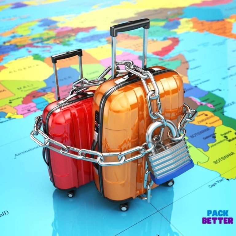 luggage with lock and chain on world map