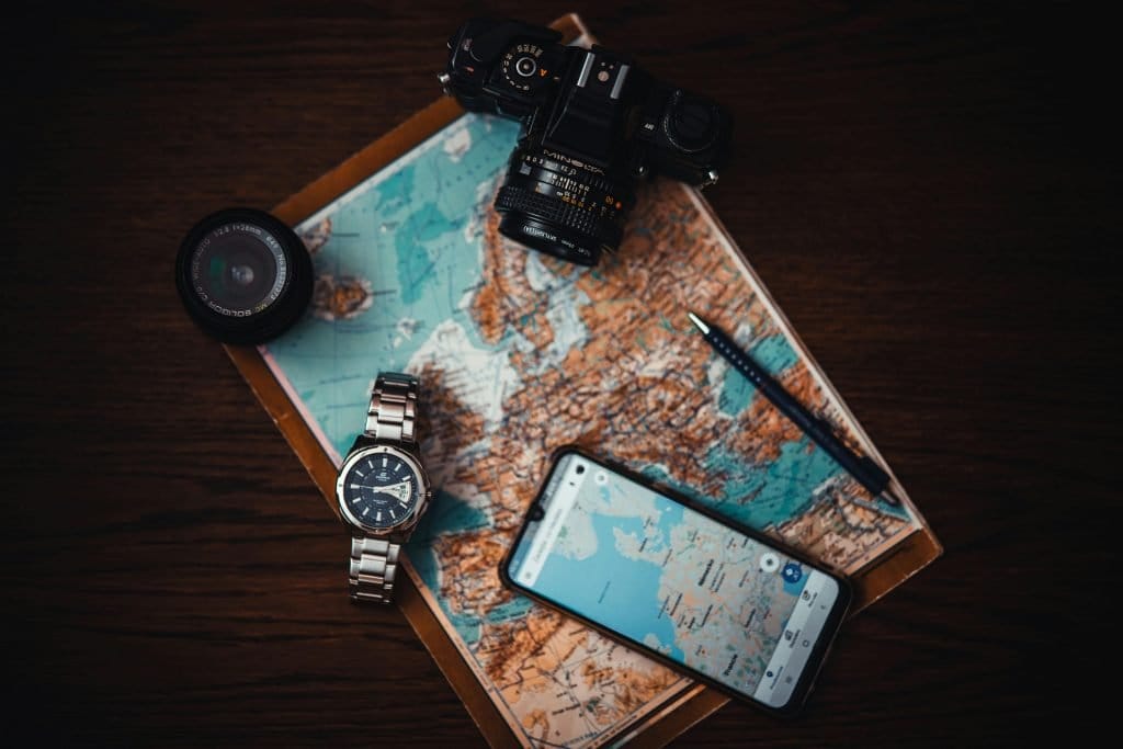 maps and cameras on desk