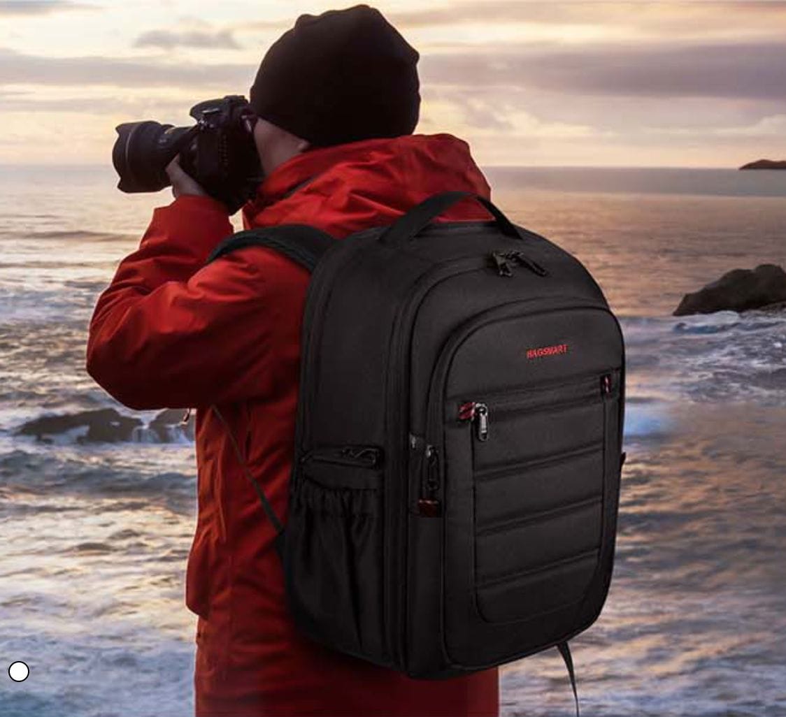 Man wearing backpack taking photo