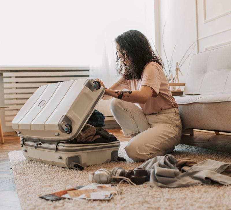 a woman packing for a travel