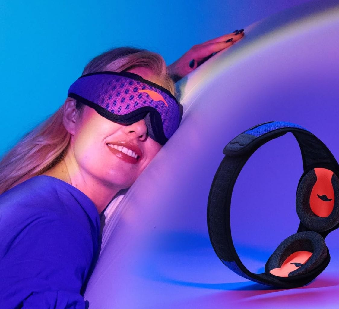 a woman sleeping wearing a Manta Pro Sleep Mask