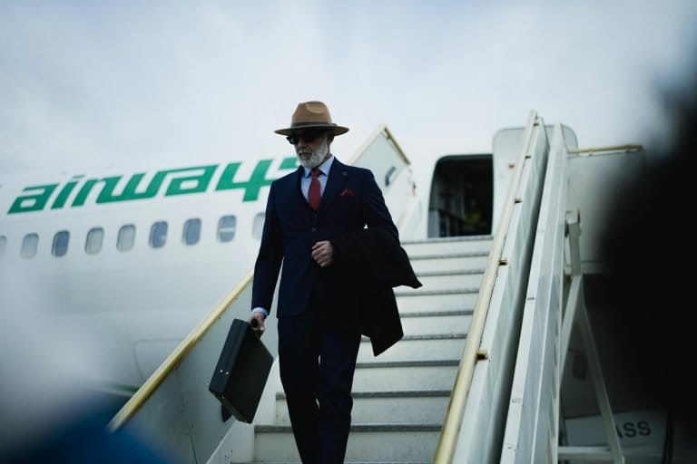 man exiting airplane